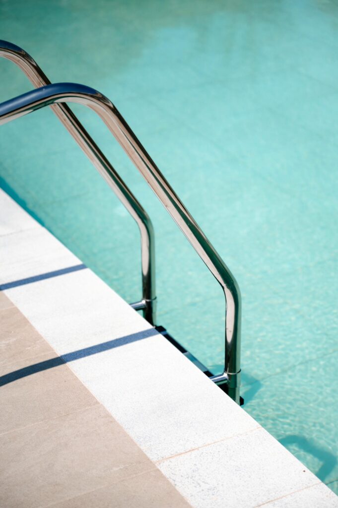 A detail of the water and the pool steps