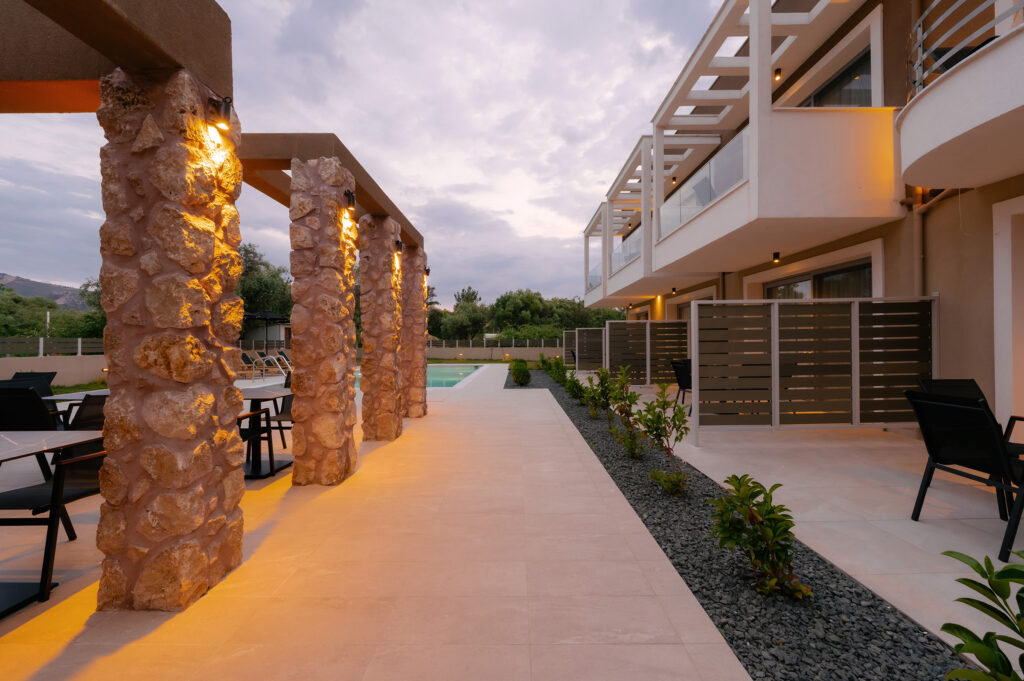 An evening architectural shot, with the stone columns lit.